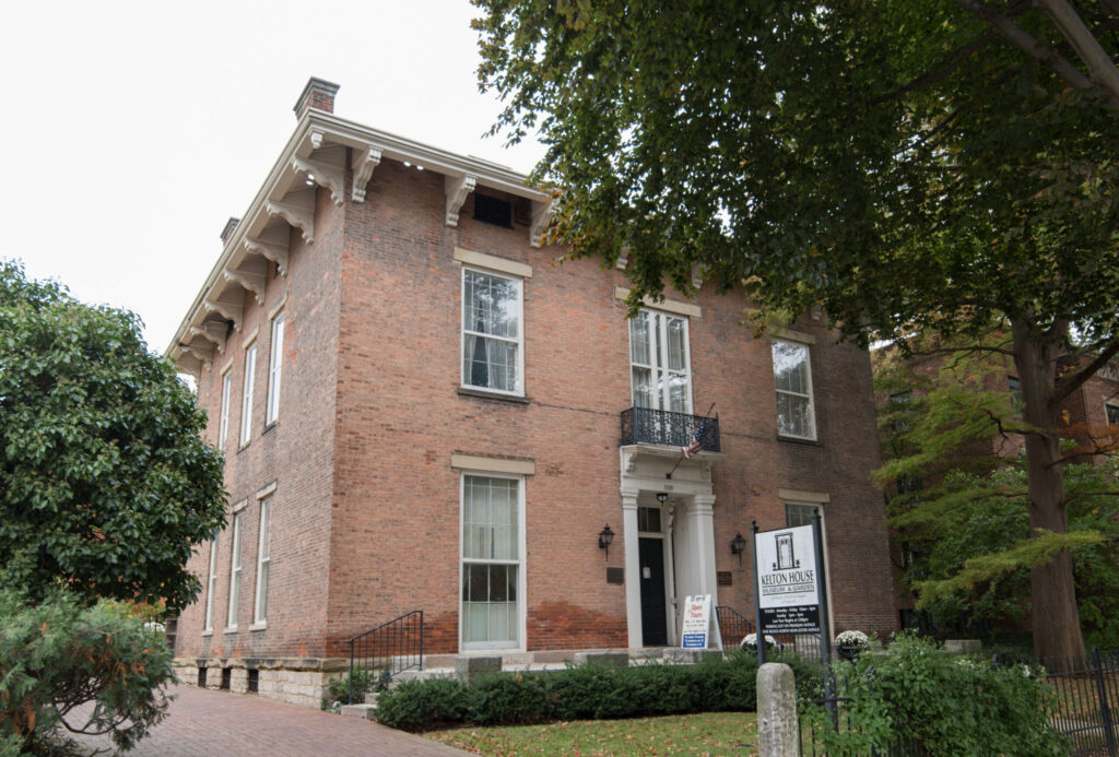 a red brick building with a sign that says Kelton House Museum and Gardens