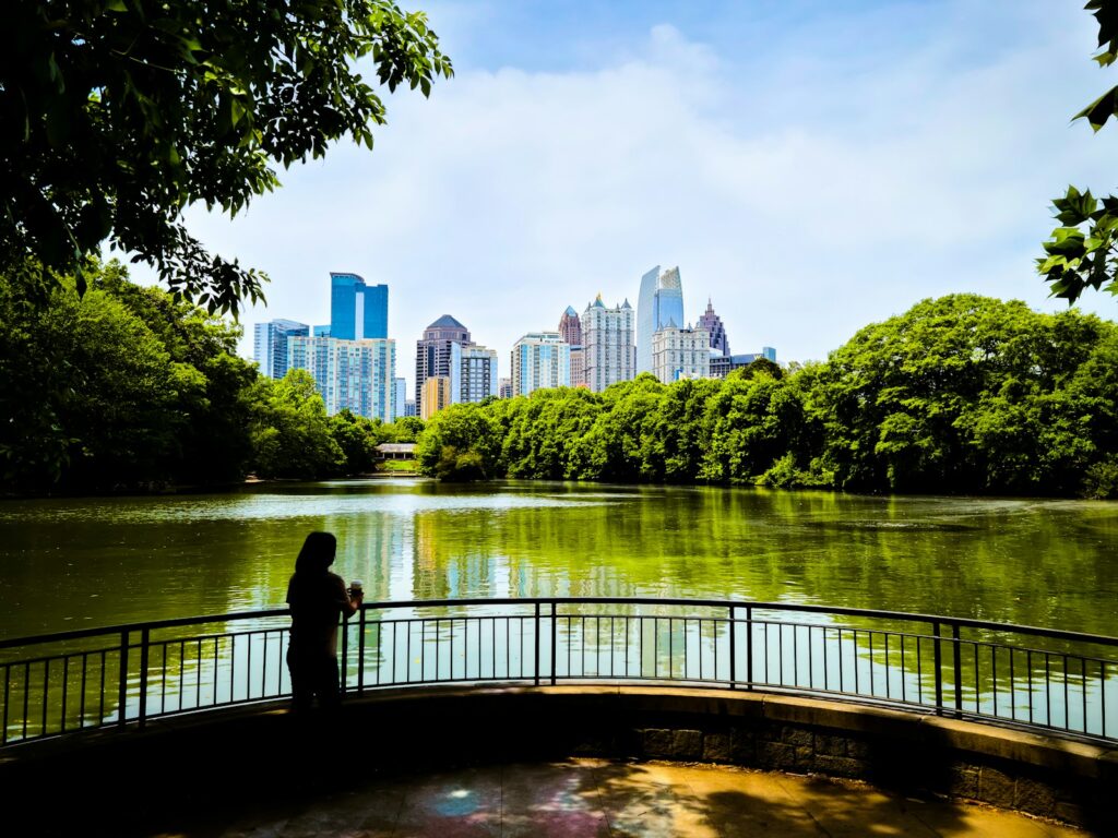 a person standing on a bridge over a river