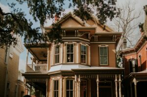 beige 2-story Victorian house