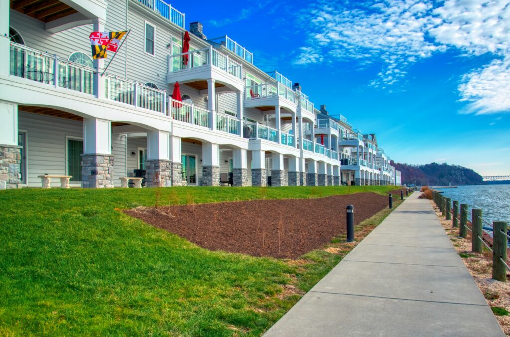 a row of townhomes in Maryland next to a body of water along the coast