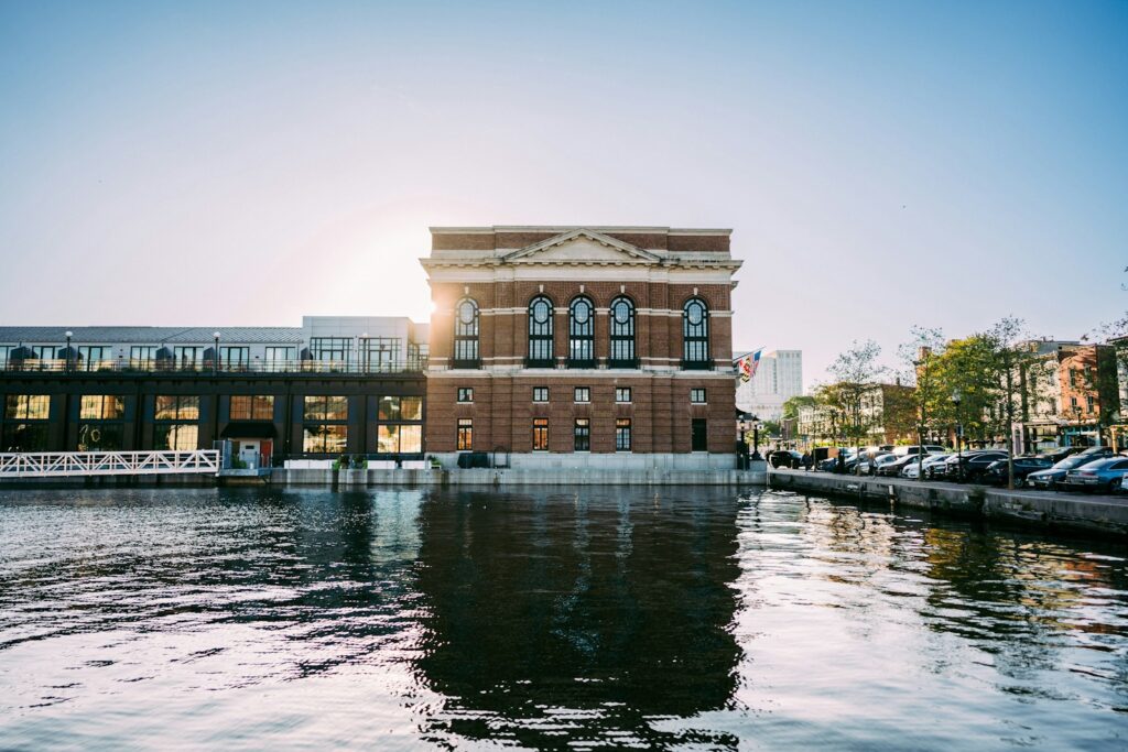 a large brick building sitting on the side of a river